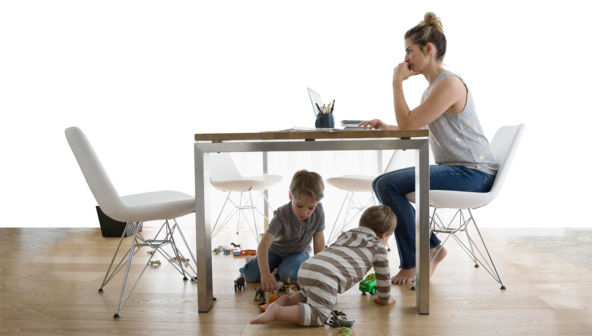 Image of mother using computer while children play